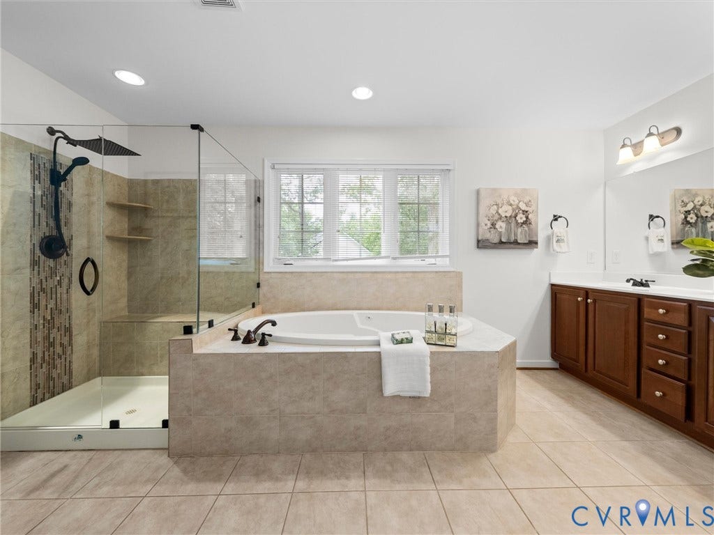 6100 Lilting Branch Way, Moseley, VA 23120 Tiled flooring leading to a walk-in shower with a glass enclosure and bench seating