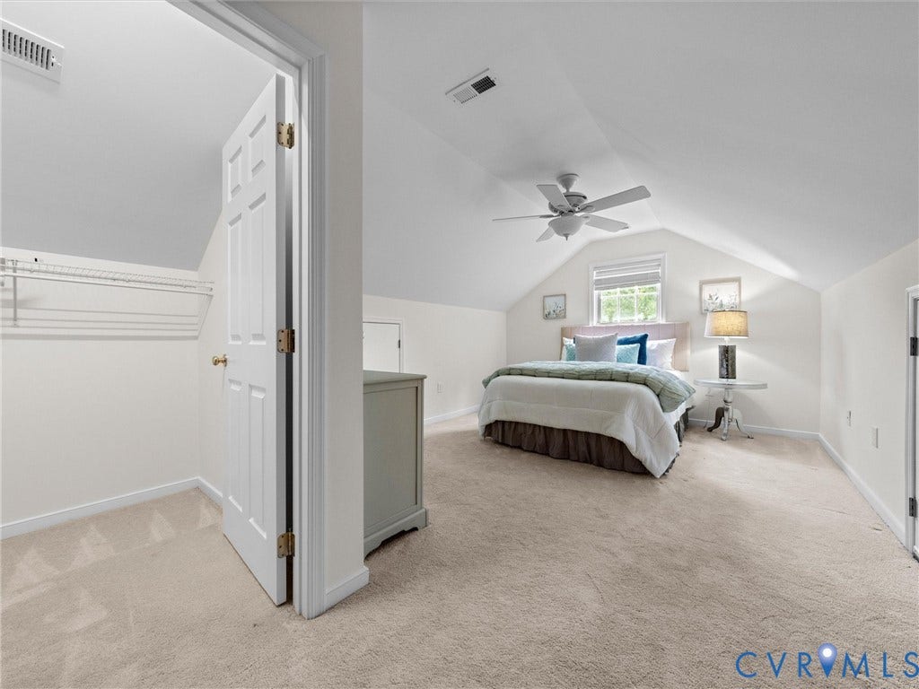 6100 Lilting Branch Way, Moseley, VA 23120 Sloped ceiling bedroom with carpet flooring, a ceiling fan, and a window providing natural light