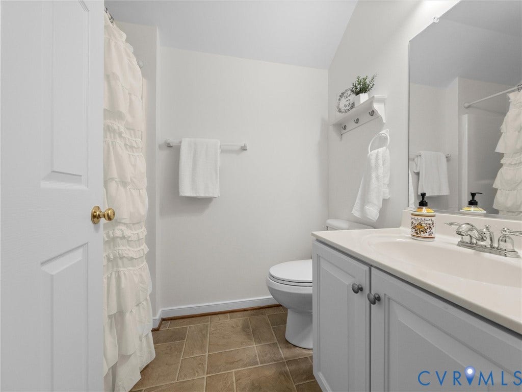 6100 Lilting Branch Way, Moseley, VA 23120 White vanity with integrated sink and chrome fixtures