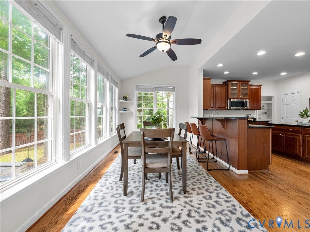 6100 Lilting Branch Way, Moseley, VA 23120 Spacious dining area with extensive window array, vaulted ceiling, and a ceiling fan