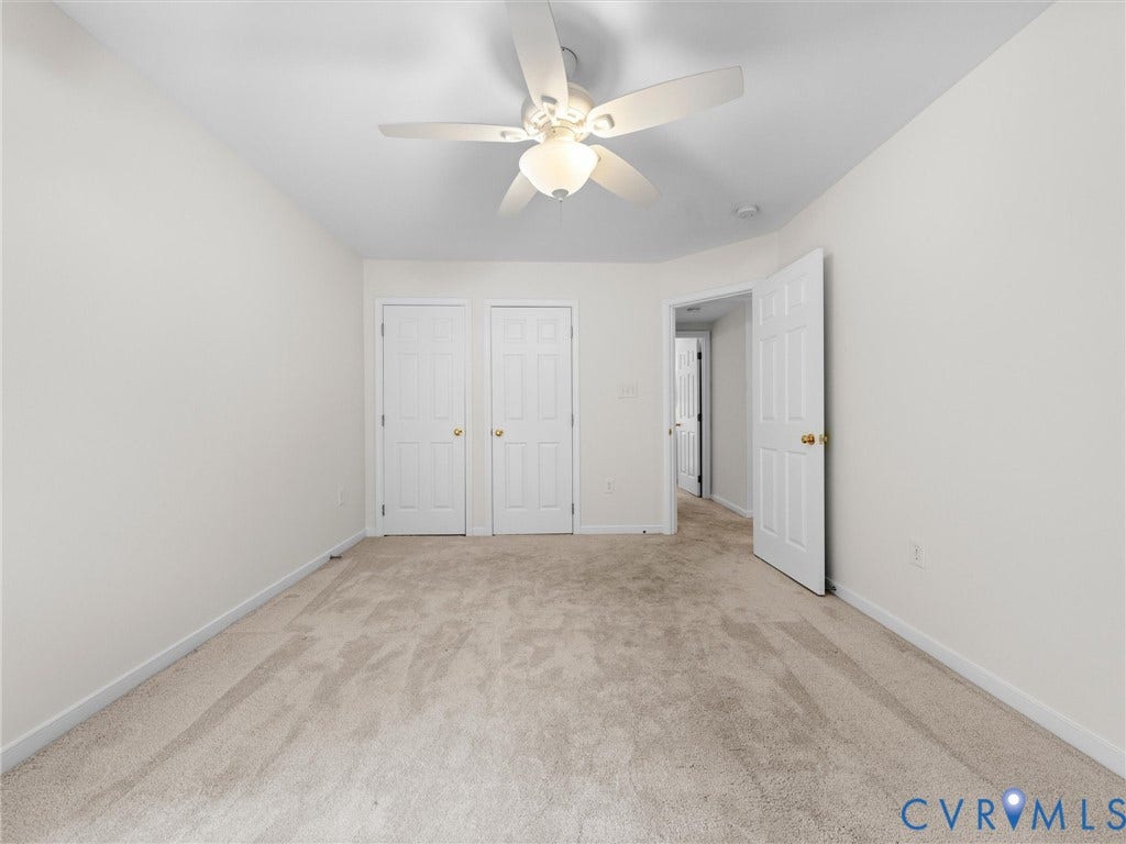 6100 Lilting Branch Way, Moseley, VA 23120 Plush carpeting, recessed ceiling, white interior doors, and a ceiling fan with integrated lighting