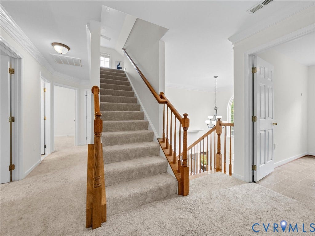 6100 Lilting Branch Way, Moseley, VA 23120 Carpeted staircase with wood-finish handrail and balusters