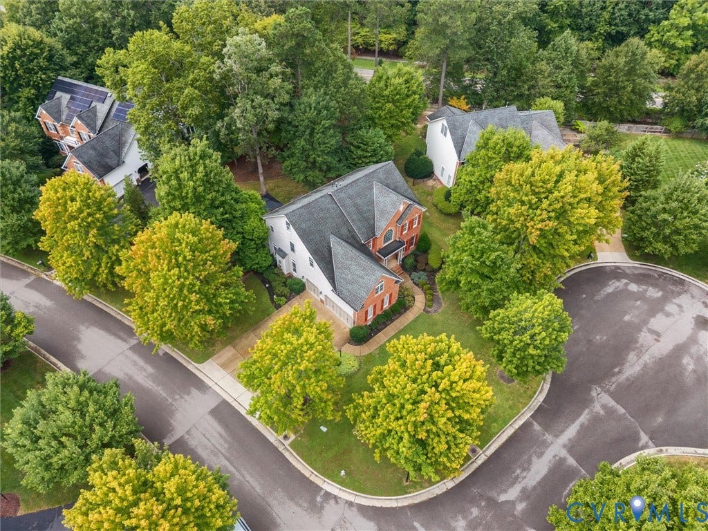 6100 Lilting Branch Way, Moseley, VA 23120 Brick-front exterior with a dark-pitched roof