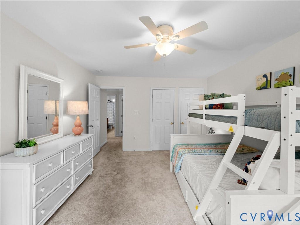 6100 Lilting Branch Way, Moseley, VA 23120 Neutral wall tones, carpet flooring, a ceiling fan with integrated lighting, and white interior doors