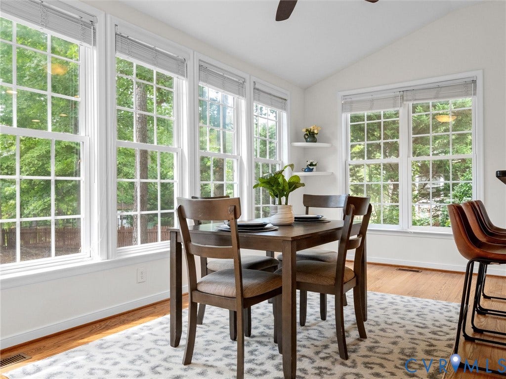 6100 Lilting Branch Way, Moseley, VA 23120 Vaulted ceiling with a ceiling fan, multiple tall windows, recessed lighting, and wood flooring
