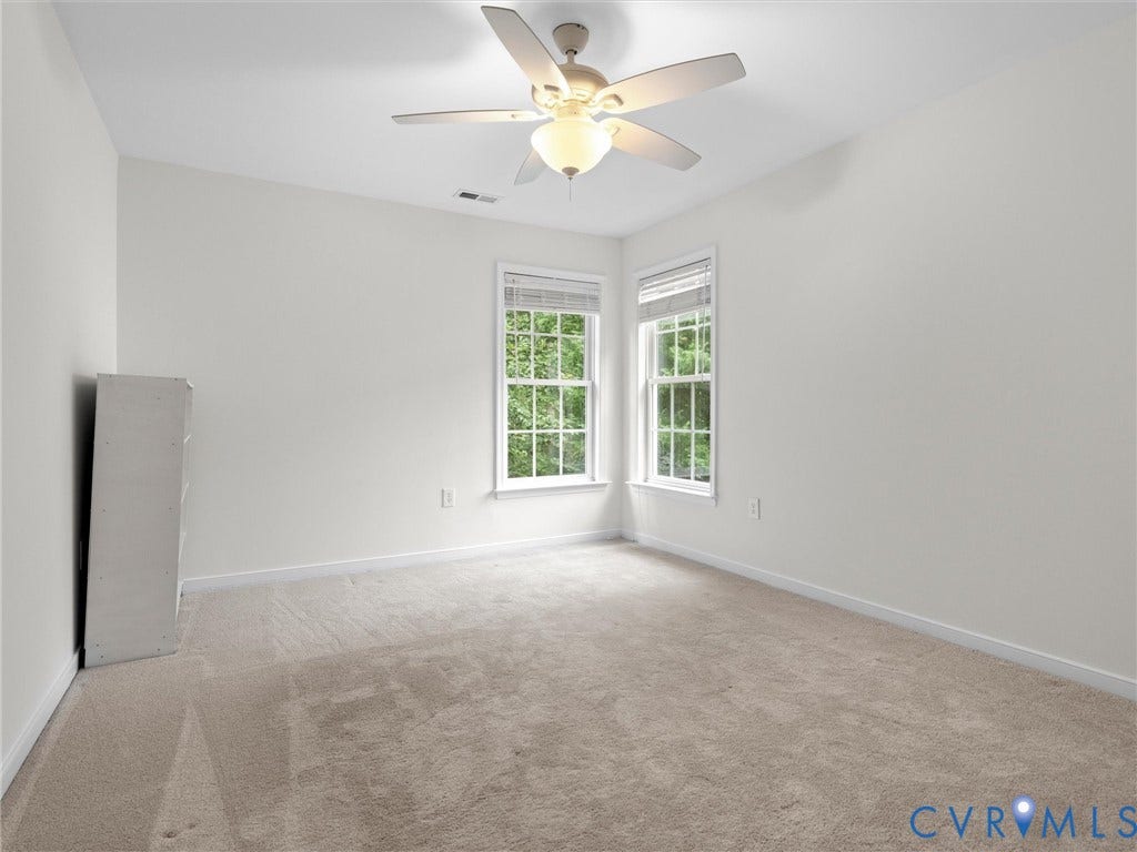 6100 Lilting Branch Way, Moseley, VA 23120 Angled ceiling, dual windows with blinds, ceiling fan with integrated lighting, and neutral carpeting