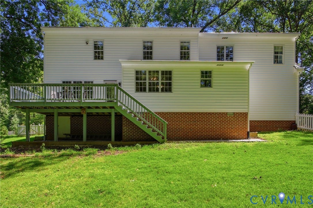 1915 Norwood Creek Drive, Powhatan, VA 23139 Expansive rear exterior featuring white siding and a brick foundation
