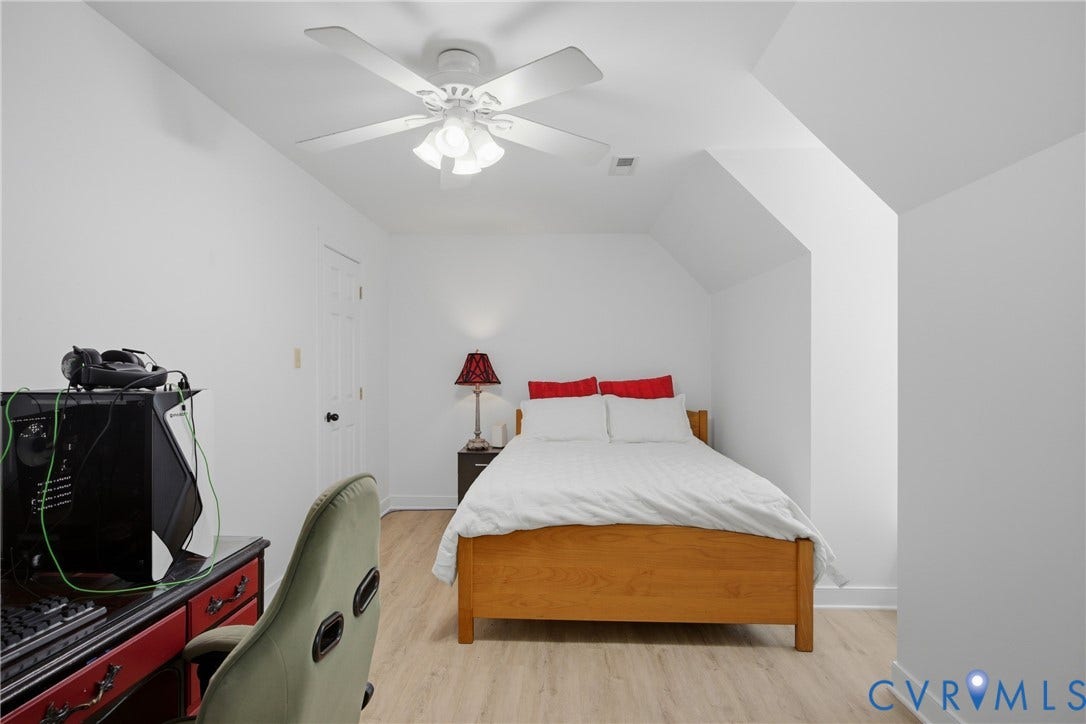 1915 Norwood Creek Drive, Powhatan, VA 23139 Room featuring light wood-finish flooring, a white ceiling fan with light fixture, and white wall finishes