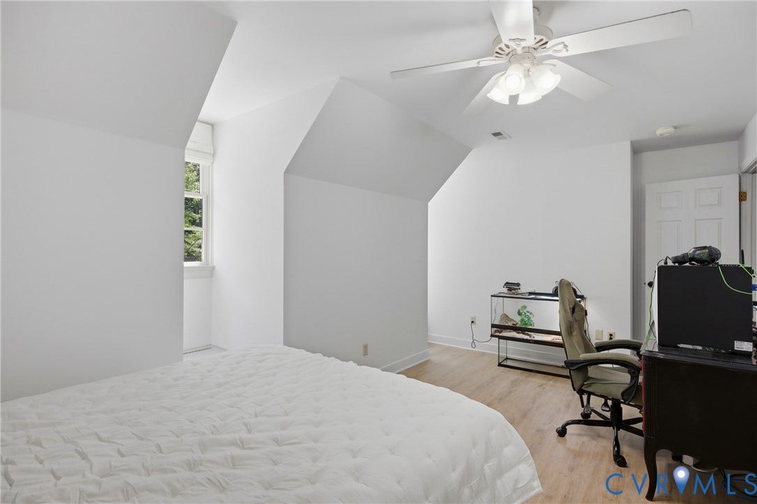 1915 Norwood Creek Drive, Powhatan, VA 23139 White walls with sloped ceilings, wood-finish flooring, and a ceiling fan with integrated lighting