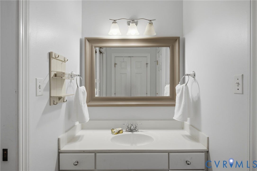 1915 Norwood Creek Drive, Powhatan, VA 23139 Hall bath, Vanity with an integrated sink, polished chrome faucet, and white countertop