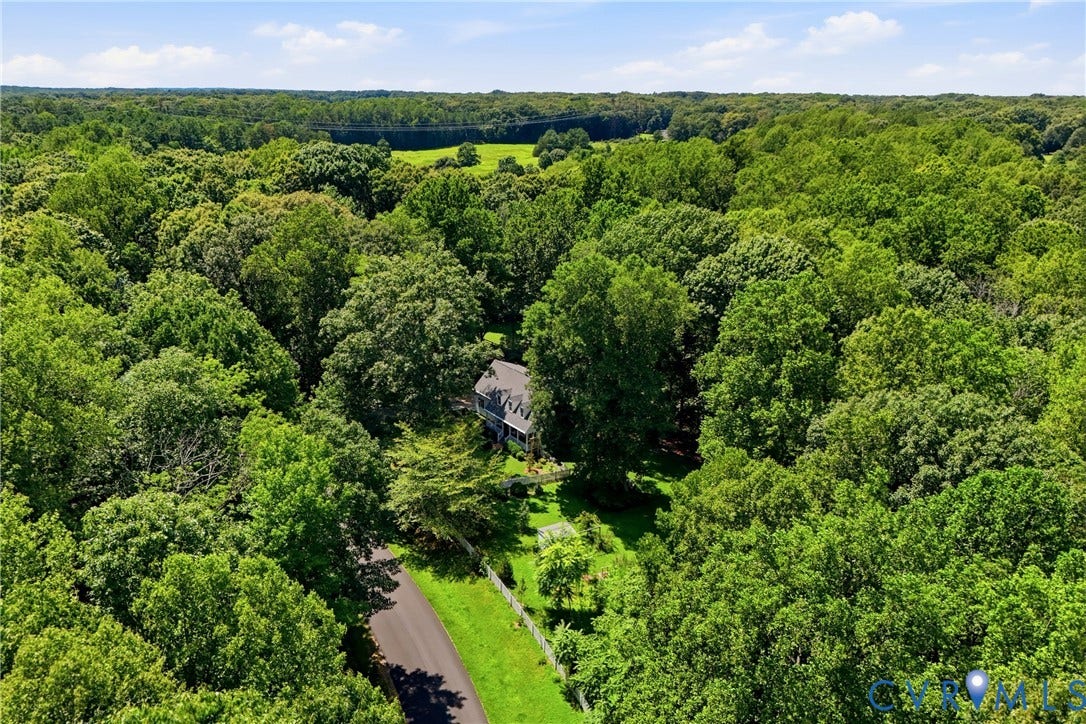 1915 Norwood Creek Drive, Powhatan, VA 23139 Estate-style residence surrounded by dense, mature tree canopy