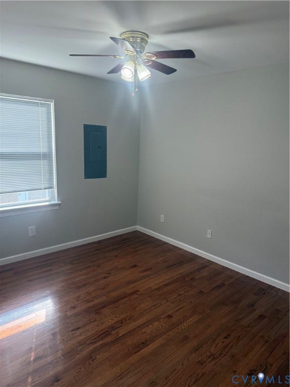 Room featuring wood-finish flooring, a window with blinds, and a ceiling fan with integrated lighting