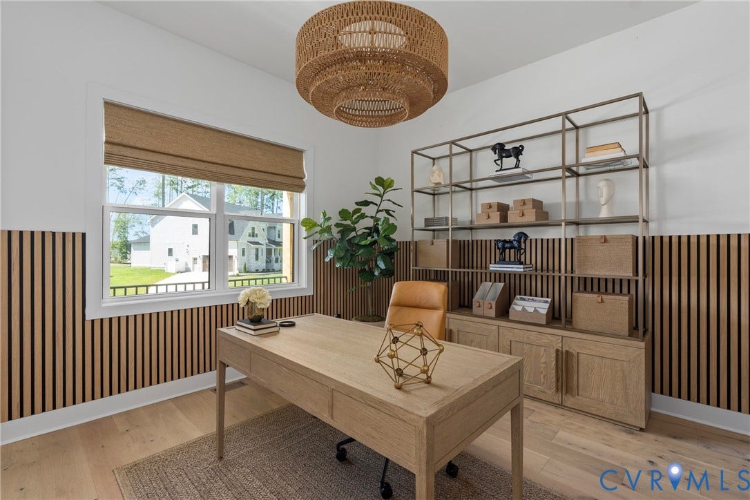 18312 Barrin Court, Barrington, Moseley, VA 23120 Bright room featuring wood-finish flooring, a contemporary overhead light fixture, and a built-in shelving unit with lower cabinetry