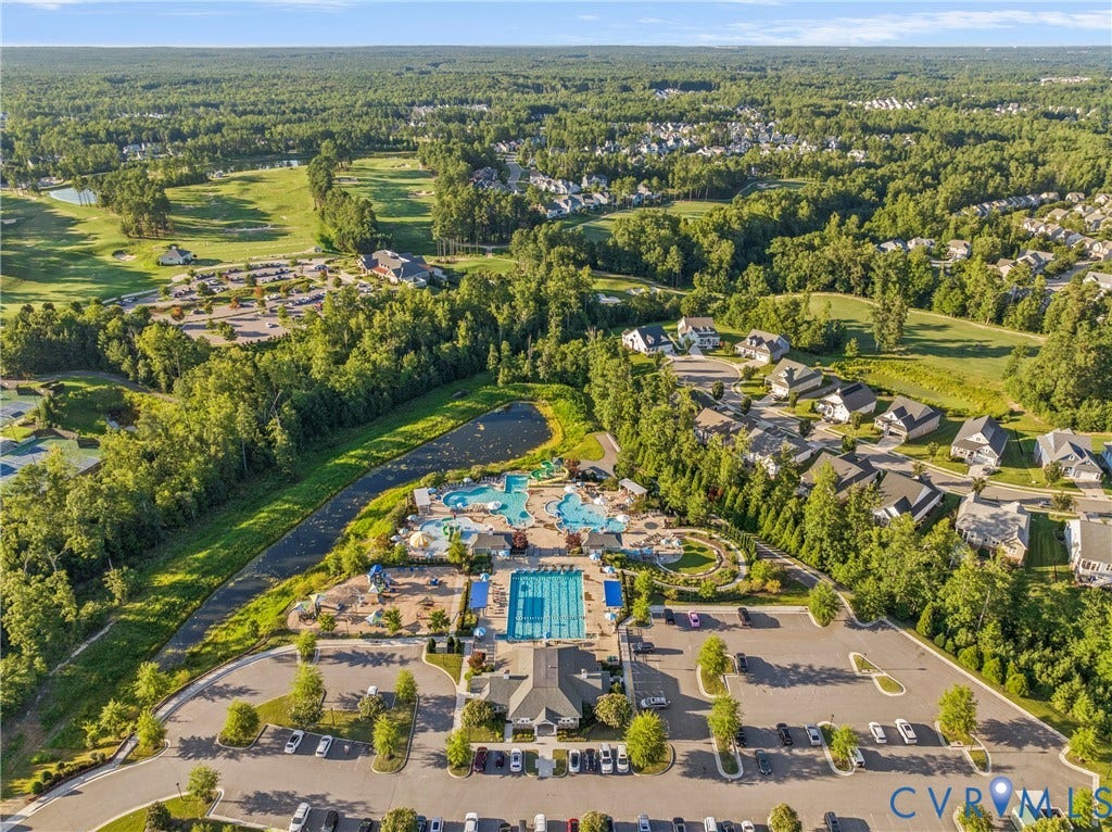 18312 Barrin Court, Barrington, Moseley, VA 23120 Aerial perspective highlighting a community recreation area with a swimming pool, splash pad, and surrounding green spaces