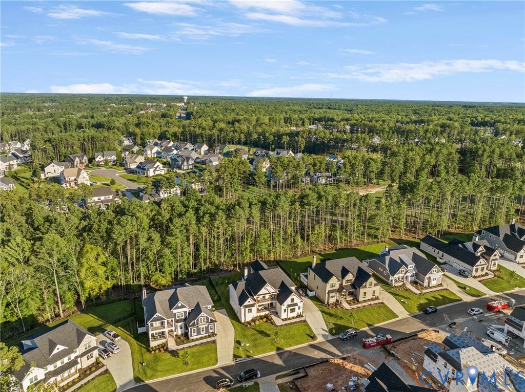 18312 Barrin Court, Barrington, Moseley, VA 23120 Aerial perspective showcasing a residential community surrounded by extensive tree coverage