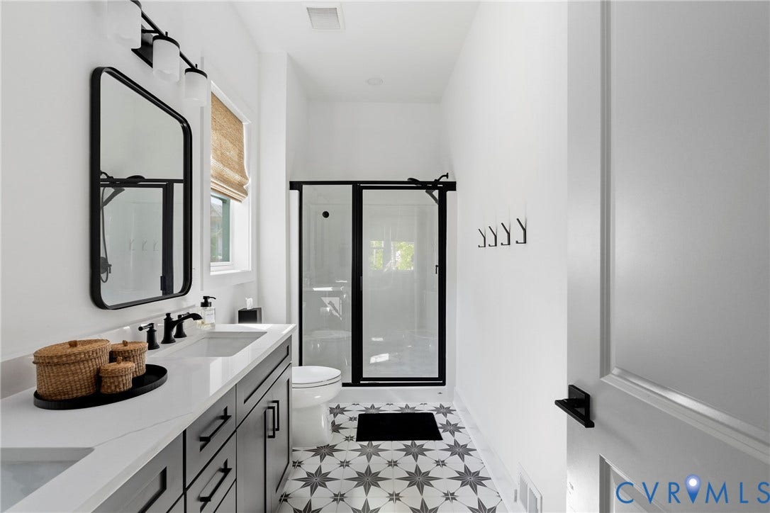 18312 Barrin Court, Barrington, Moseley, VA 23120 Full bathroom featuring a single vanity with dark cabinetry, white countertop, and rectangular sink