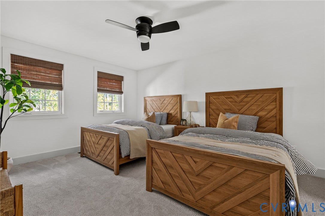18312 Barrin Court, Barrington, Moseley, VA 23120 Spacious room featuring light gray carpeting, two windows with woven wood blinds, and a black ceiling fan