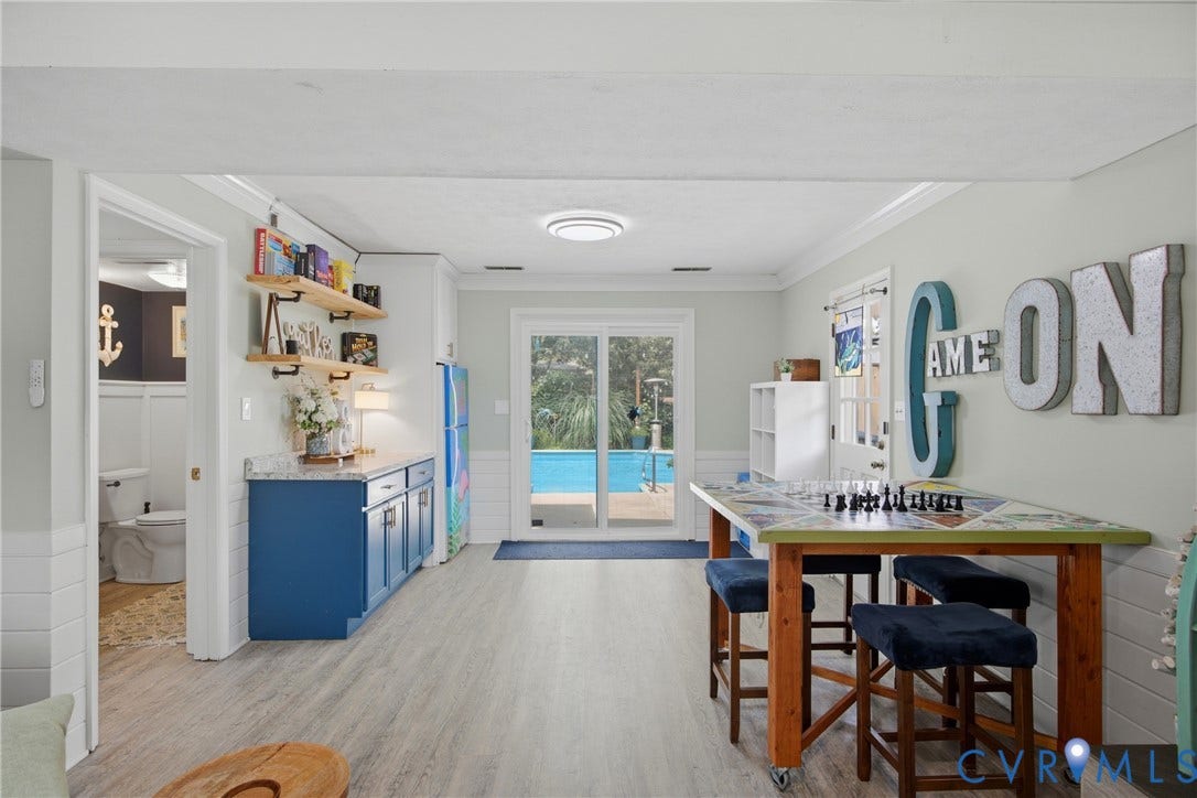 Open concept area featuring light wood-finish flooring
