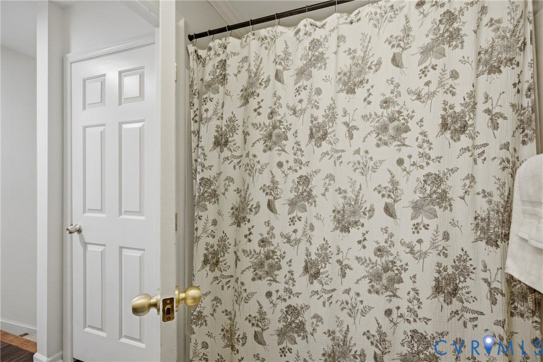White six-panel interior door with brushed nickel hardware