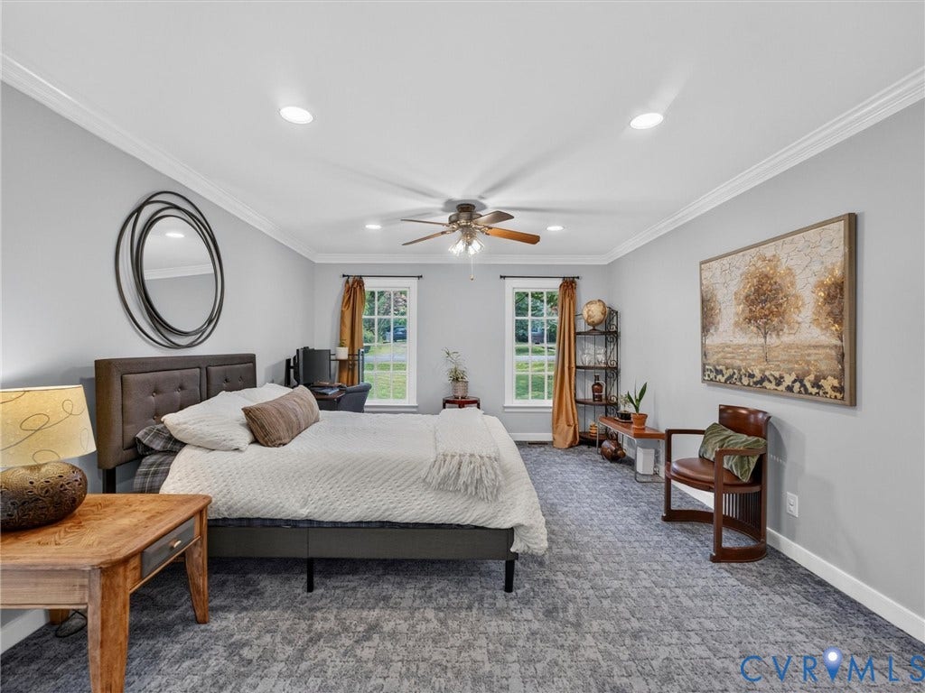 Recessed lighting, crown molding, ceiling fan, and two windows with natural light