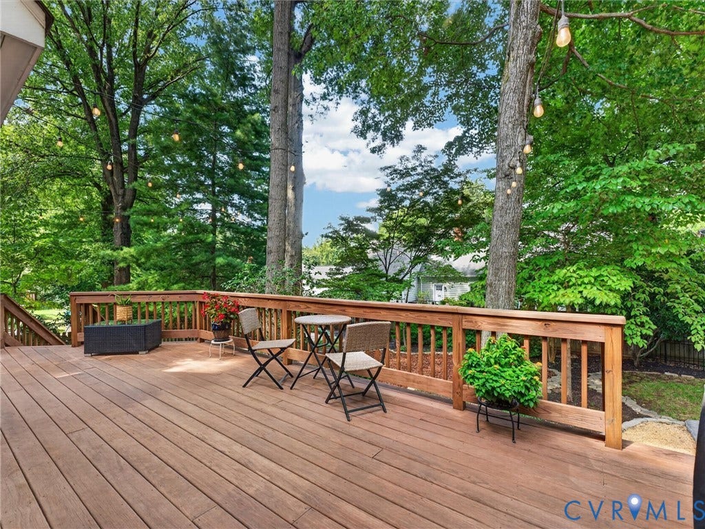 Wood-finish deck with a natural wood railing and balusters