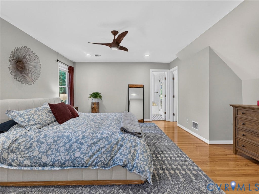 Hardwood flooring, recessed lighting, and a contemporary ceiling fan