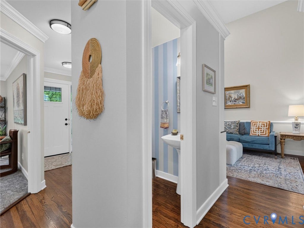 Hardwood flooring, crown molding, white trim, recessed lighting, pedestal sink