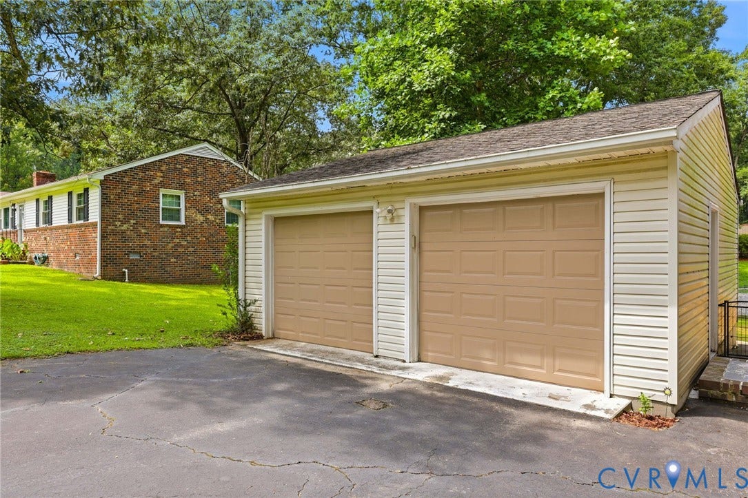 3300 Woodsong Drive, Midlothian, VA 23112 Detached two-car garage with two garage doors and light-colored siding