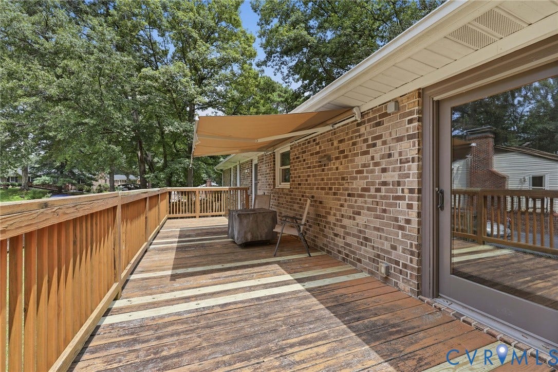 3300 Woodsong Drive, Midlothian, VA 23112 Spacious exterior deck featuring wood railing and a retractable awning