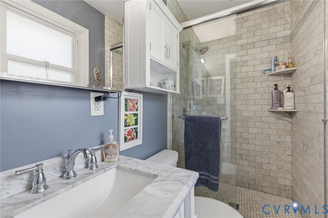 3300 Woodsong Drive, Midlothian, VA 23112 Bathroom featuring a glass-enclosed shower with subway tile surround and a tiled floor