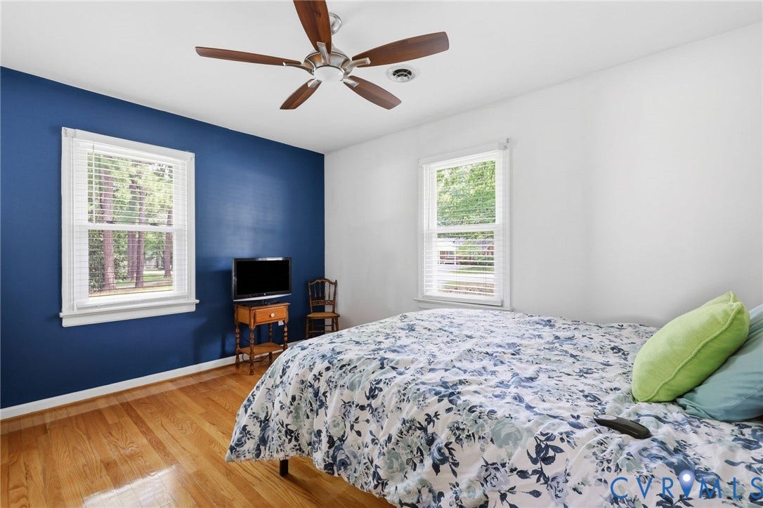 3300 Woodsong Drive, Midlothian, VA 23112 Bright interior space featuring wood-finish flooring, white trim, and a ceiling fan with wood-tone blades