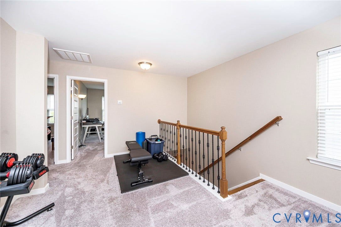 7205 Desert Candle Drive, Moseley, VA 23120 Upper-level landing featuring carpeted flooring and neutral wall tones