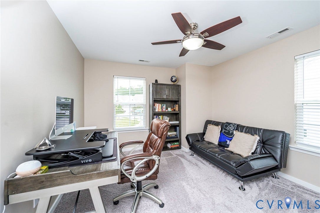7205 Desert Candle Drive, Moseley, VA 23120 Room featuring light neutral wall paint, light-toned carpet flooring, and a ceiling fan with integrated lighting