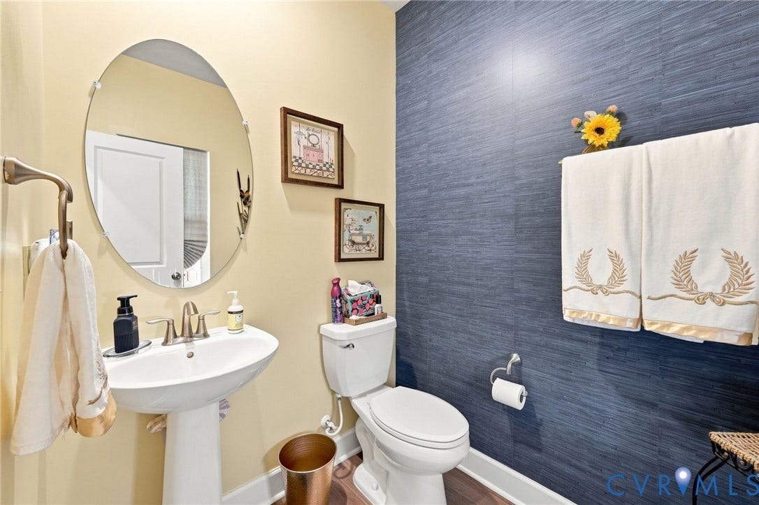 Pedestal sink with brushed nickel faucet