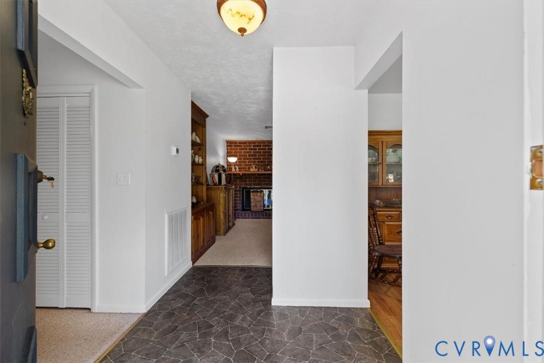 2311 Georges Road, Powhatan, VA 23139 Foyer entry with dark geometric tile flooring and a ceiling-mounted light fixture