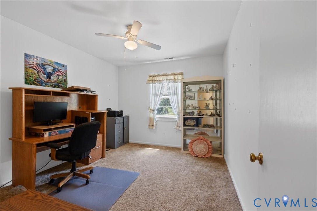 2311 Georges Road, Powhatan, VA 23139 Carpeted room with a ceiling fan, window, and light-toned walls