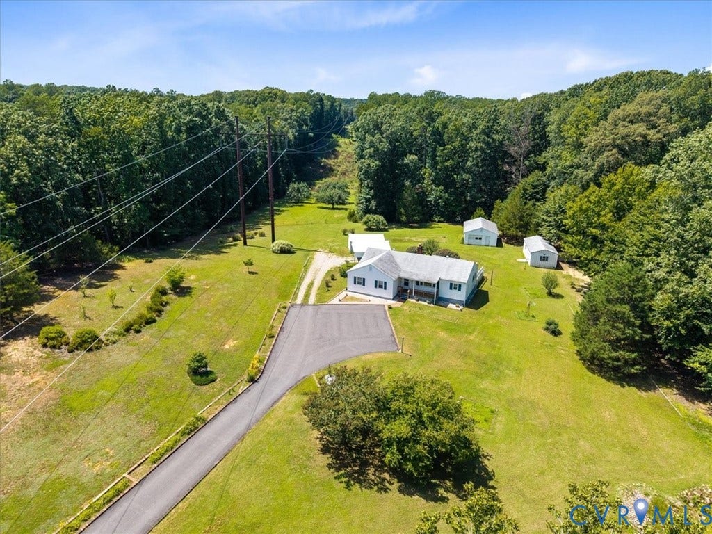 2311 Georges Road, Powhatan, VA 23139 Expansive property featuring a residence with light-colored siding, a dark roof, and an attached carport