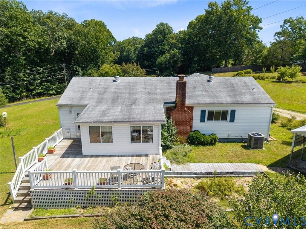 2311 Georges Road, Powhatan, VA 23139 Spacious rear deck with white railing, featuring a lattice skirt and direct access to interior spaces