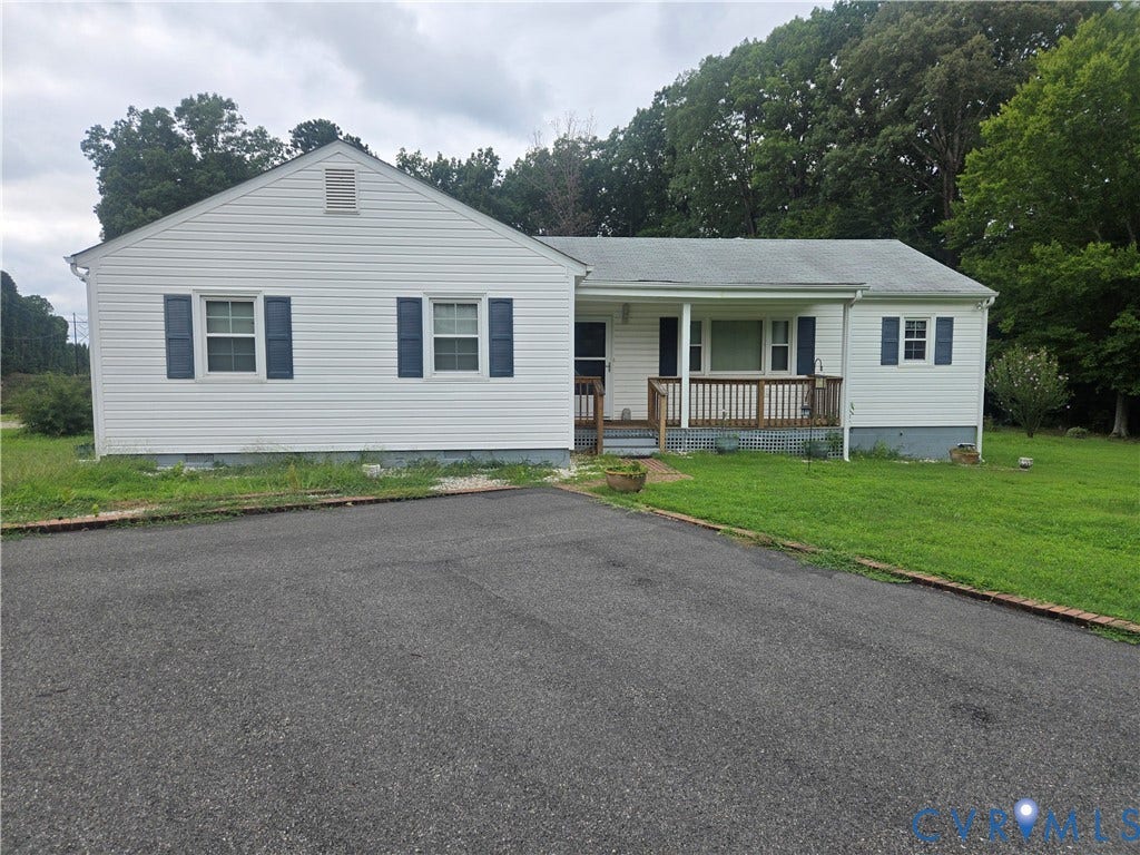 2311 Georges Road, Powhatan, VA 23139 White siding exterior featuring blue window shutters and a covered front porch with wood railings