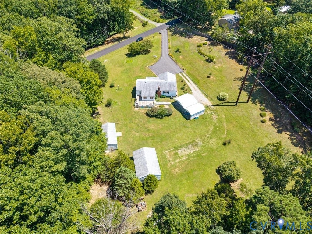 2311 Georges Road, Powhatan, VA 23139 Expansive property featuring a central residence, multiple outbuildings, and extensive green space