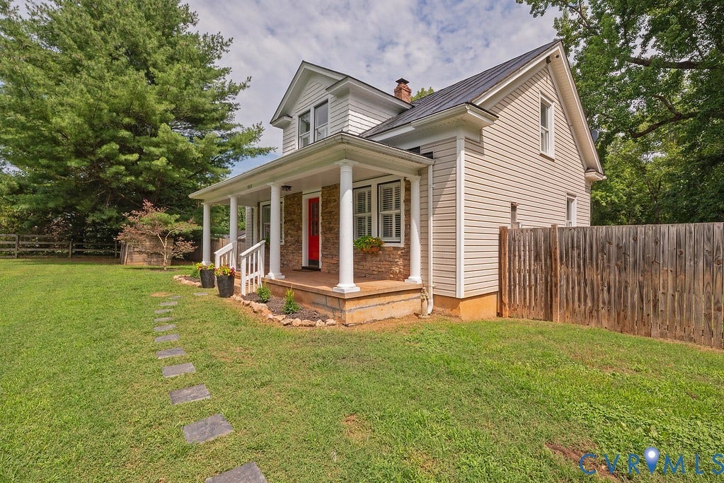 4808 River Road W Road, Goochland, VA 23063 Traditional-style home featuring white siding and a covered front porch with white columns