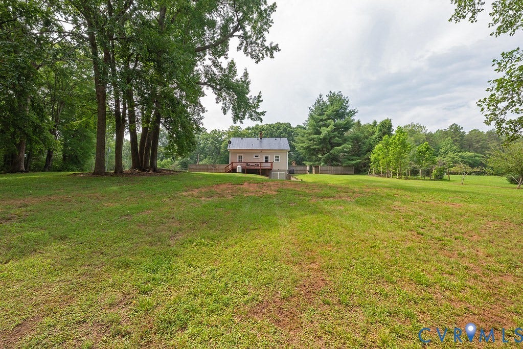 4808 River Road W Road, Goochland, VA 23063 Expansive grassy yard with mature trees and a rear deck