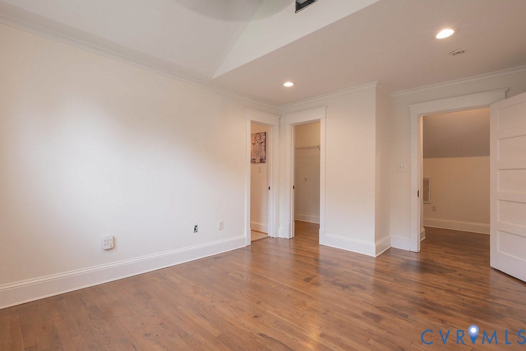 4808 River Road W Road, Goochland, VA 23063 Warm wood-finish flooring, white baseboards, and bright white walls