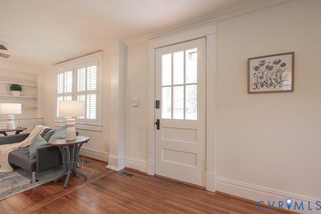 4808 River Road W Road, Goochland, VA 23063 Warm wood-finish flooring complements the crisp white trim and solid door with glass panels