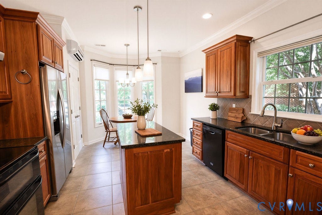 14007 Shawhan Court, Charter Colony, Midlothian, VA 23114 Wood-finish cabinetry with a center island and dark countertops