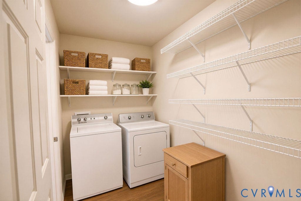 14007 Shawhan Court, Charter Colony, Midlothian, VA 23114 Dedicated laundry area featuring a washer and dryer, wood-finish flooring, built-in wire shelving, and additional wall-mounted shelving
