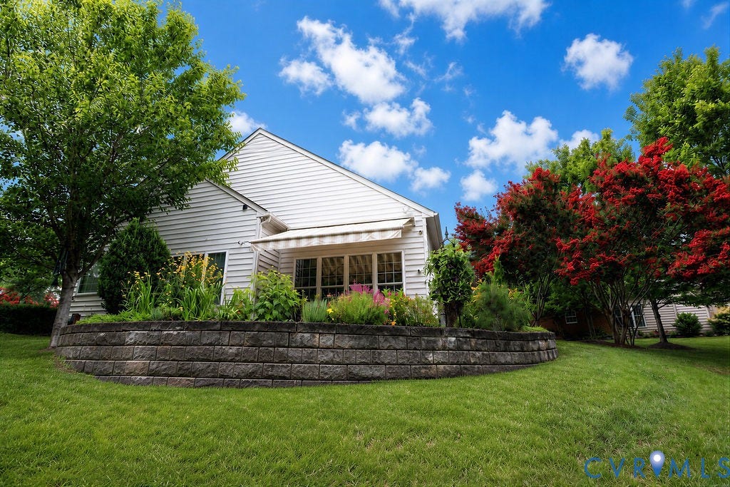 14007 Shawhan Court, Charter Colony, Midlothian, VA 23114 Expansive lawn with mature trees, a retaining wall, and planted garden beds