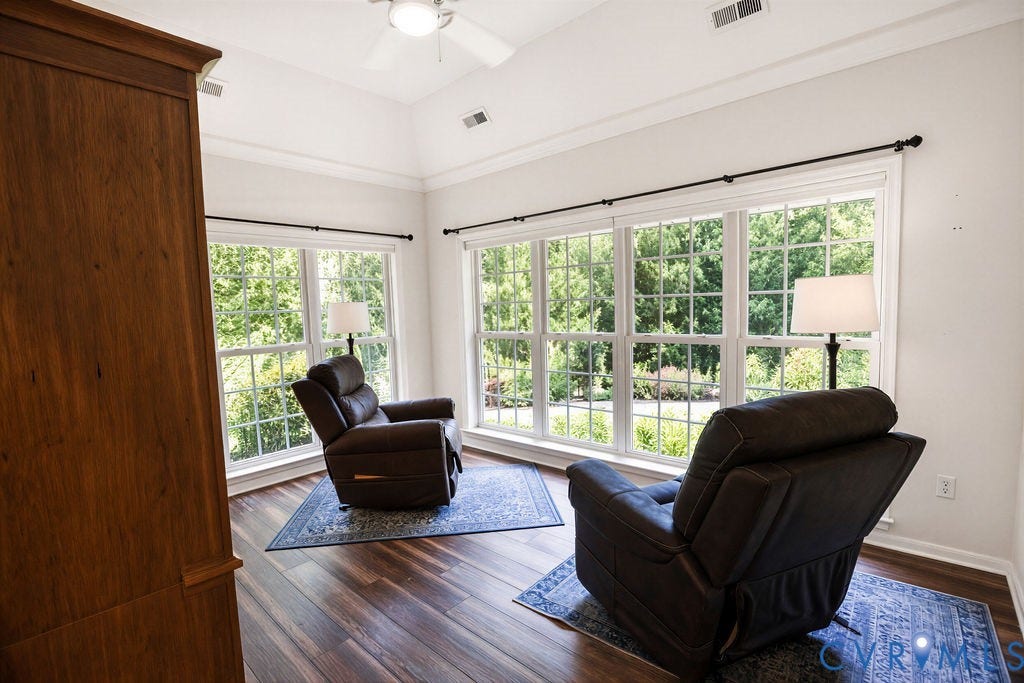 14007 Shawhan Court, Charter Colony, Midlothian, VA 23114 Vaulted ceiling with a ceiling fan, crown molding, large multi-pane windows, and wood-finish flooring