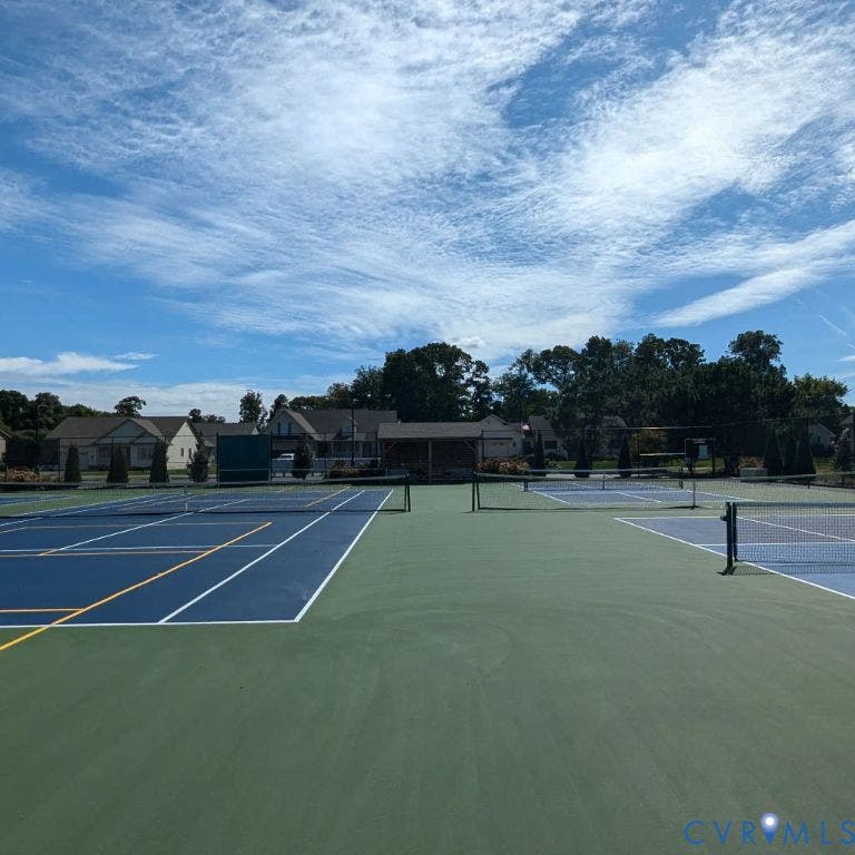 14007 Shawhan Court, Charter Colony, Midlothian, VA 23114 Multi-court tennis facility featuring blue and green playing surfaces, white court lines, and multiple tennis nets