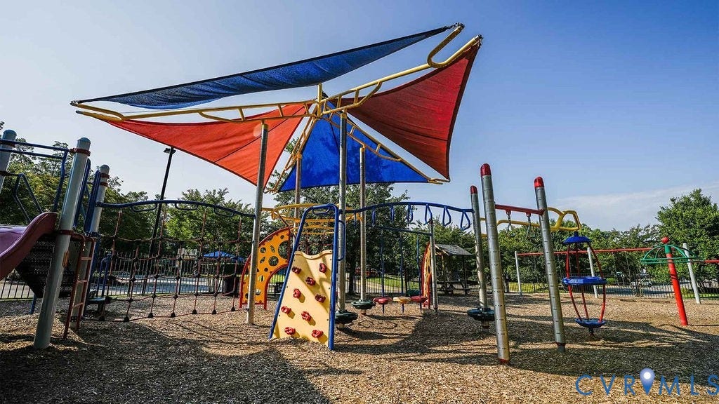 14007 Shawhan Court, Charter Colony, Midlothian, VA 23114 Playground area featuring shade sails, climbing structures, and swing sets over wood-chip surfacing